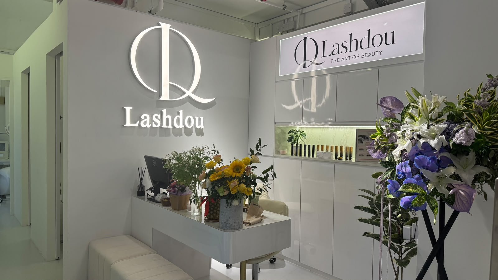 Lashdou salon reception and logo wall